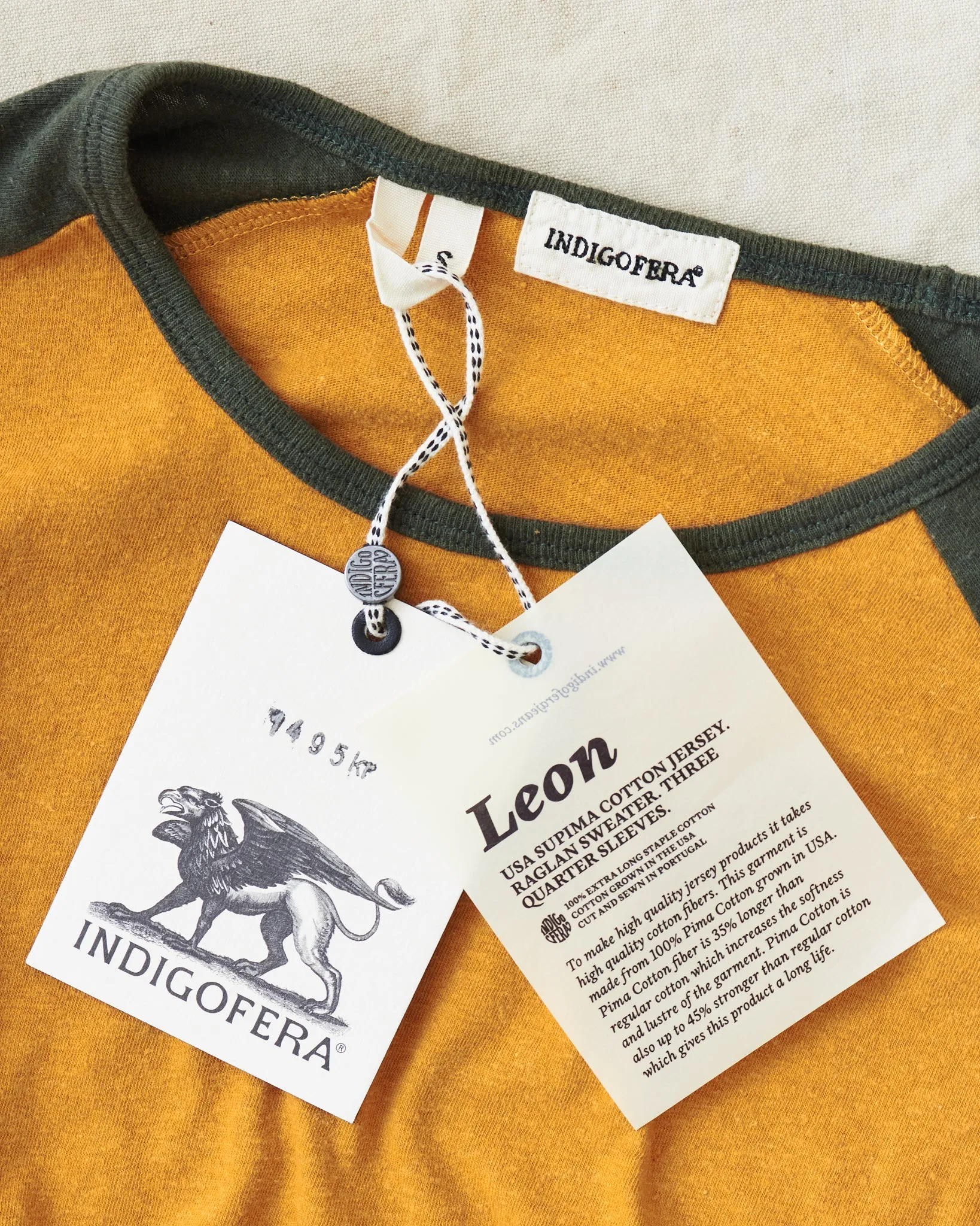 Indigofera Leon Raglan Sweater Orange / Green Resin