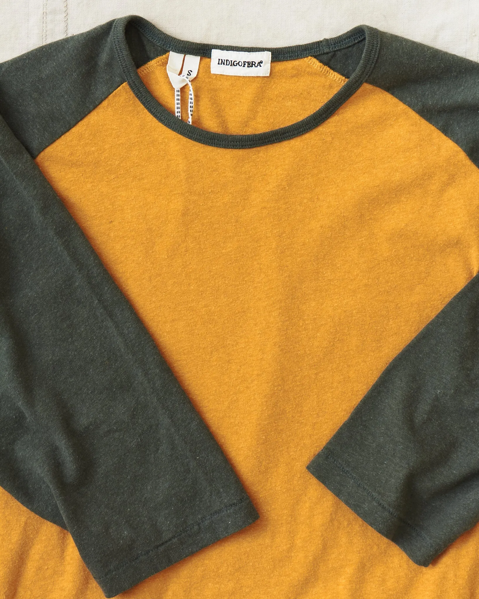 Indigofera Leon Raglan Sweater Orange / Green Resin